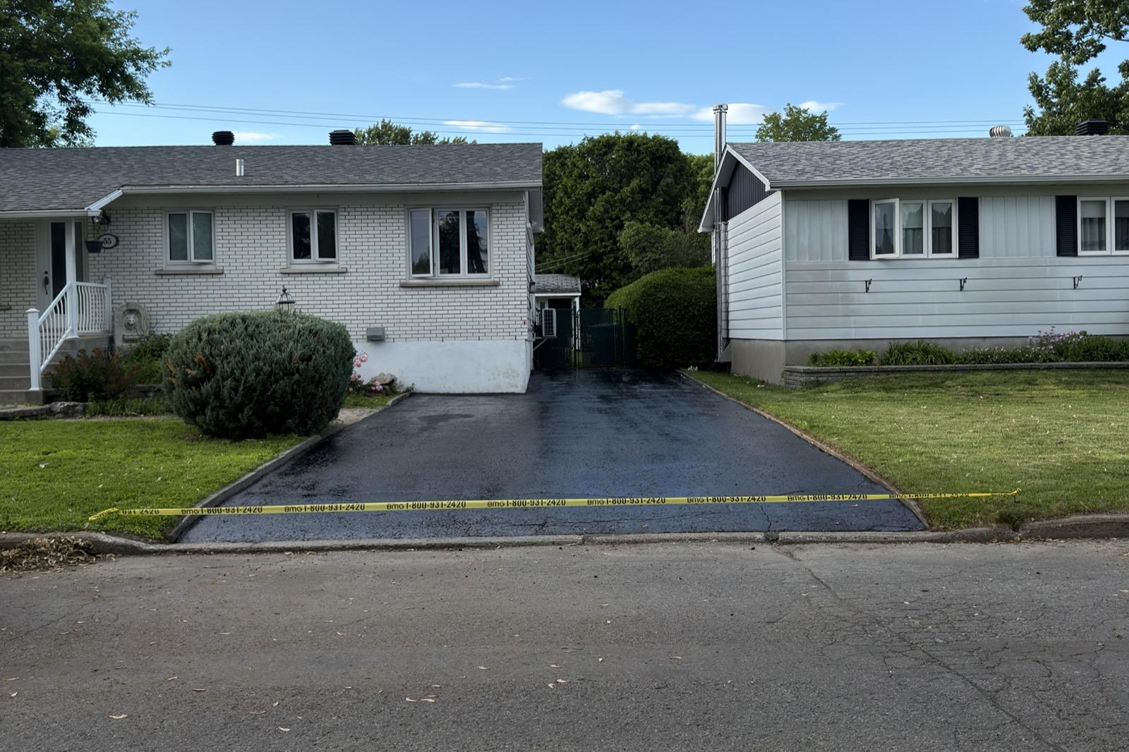 Asphalt sealcoating — residential driveway — After