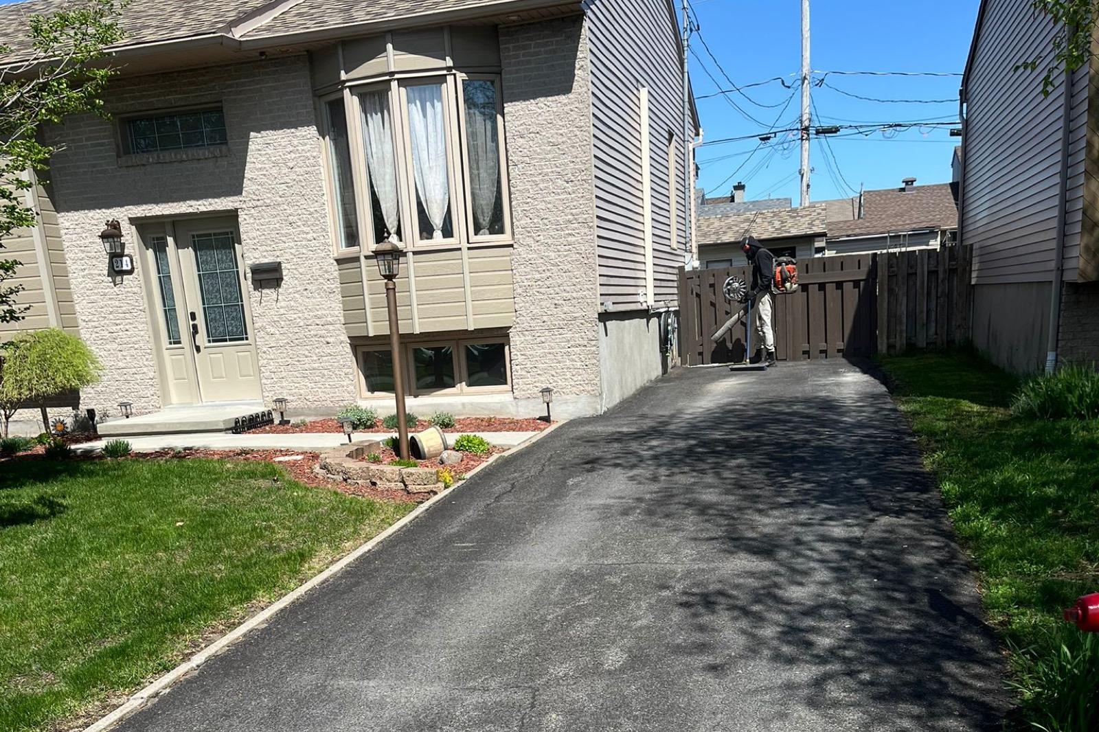 Asphalt path brought back to life with sealant — Before